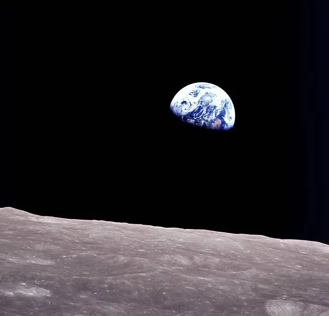 A view from the surface of the moon with the earth rising 